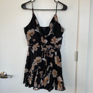 Francesca’s Black Romper with Orange Floral Pattern